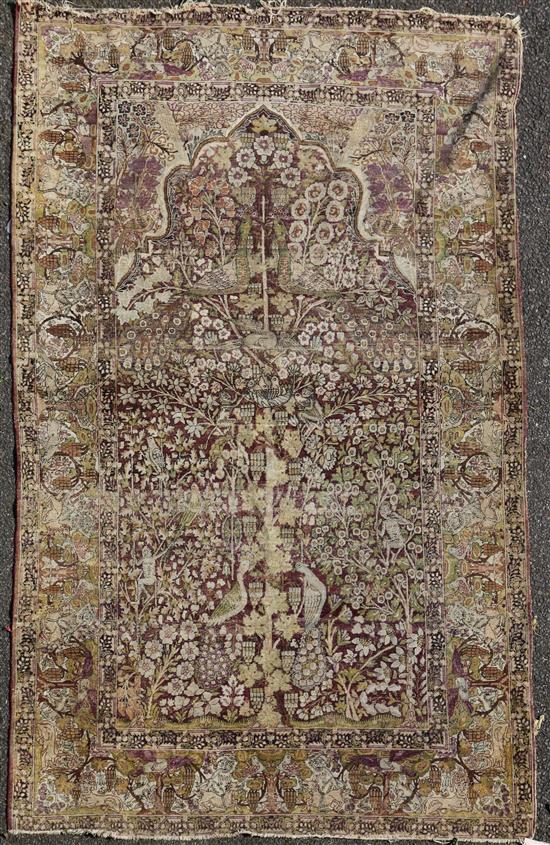 An antique Kirman? Tree of Life rug, 7ft 2in by 4ft 8in.